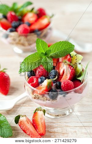 Summer Dessert With Strawberries On A Wooden Background.