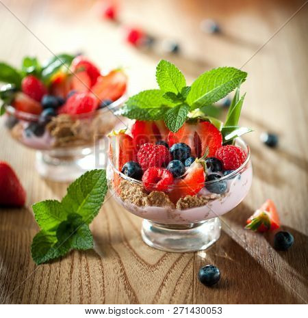 Summer Dessert With Strawberries On A Wooden Background.