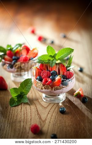 Summer Dessert With Strawberries On A Wooden Background.