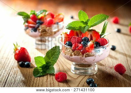 Summer Dessert With Strawberries On A Wooden Background.