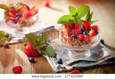 Summer Dessert With Strawberries On A Wooden Background.