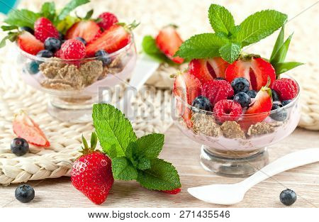 Summer Dessert With Strawberries On A Wooden Background.