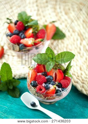 Summer Dessert With Strawberries On A Wooden Background.