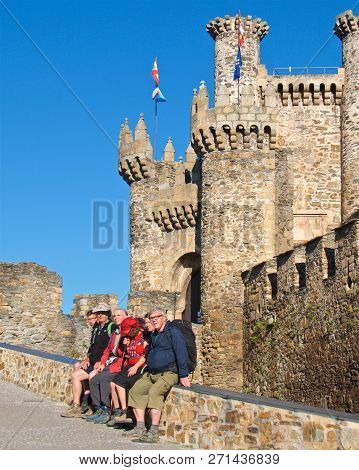 Ponferrada, Spain - September 2018: Pilgrims Of Camino De Santiago Stopped By Templar Castle In Ponf