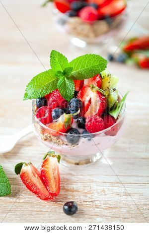 Summer Dessert With Strawberries On A Wooden Background.