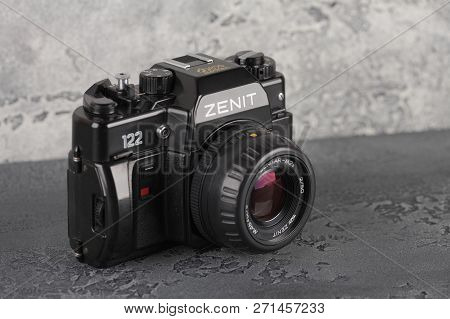 Moscow, Russia, November 29, 2018. The Old Soviet 35 Mm Slr Camera Zenit 122, Released 1997, On A Gr