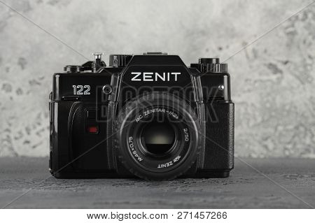 Moscow, Russia, November 29, 2018. The Old Soviet 35 Mm Slr Camera Zenit 122, Released 1997, On A Gr
