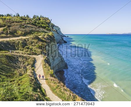 View From Peroulades View Point On Of White Rock Steep Cliff Volcanic Bay Of Cape Drastis And Peroul