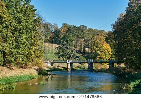 Historic Bridge Over The Nysa Łużycka River During Autumn On The Border Between Poland And Germany