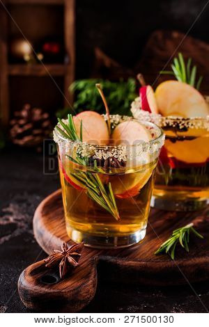 Traditional Christmas Apple Punch With Cinnamon, Anise And Sprigs Of Rosemary On Dark Background Tab