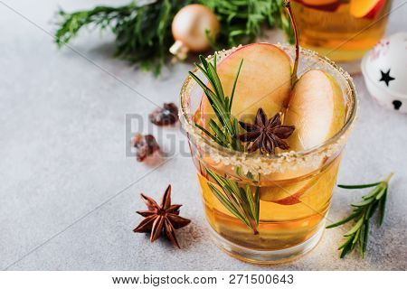 Traditional Christmas Apple Punch With Cinnamon, Anise And Sprigs Of Rosemary On Light Background. S