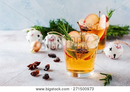 Traditional Christmas Apple Punch With Cinnamon, Anise And Sprigs Of Rosemary On Light Background. S