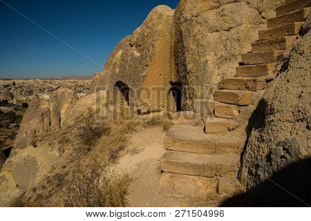 Cappadocia, Anatolia, Turkey: Degrees In The Rock Lead To The Church. The World Heritage List Of Une
