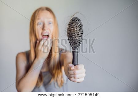 Hair Loss In Women Concept. A Lot Of Lost Hair On The Comb