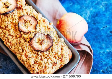 Homemade Apple Crumble Cake Served On A Wire Rack On A White Sto