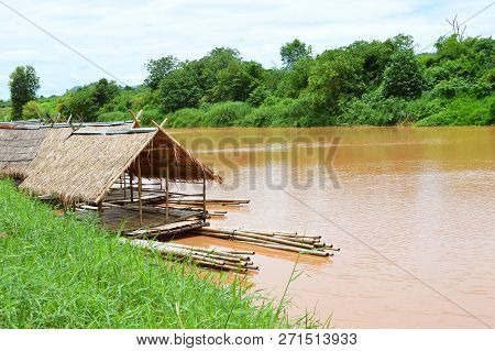 landscape of river mountain and bamboo houseboat raft floating for relax in holiday time
