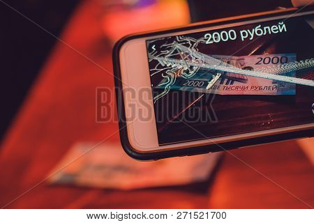 Ufa, Russia, 1 July, 2018: Applications For Identifying Real Bills Banknote Of Two Thousand. 2000 Ru