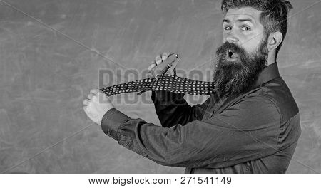 Man Scruffy Use Stapler Dangerous Way. Hipster Teacher Formal Wear Necktie Holds Stapler. School Sta