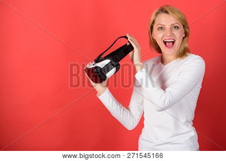A Person In Virtual Glasses Flies In Room Space. Confident Young Woman Adjusting Her Virtual Reality