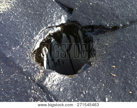 Drain Hole In The Ruberoid Roof Of The Garage, Sealed With Bitumen When Repairing It Yourself