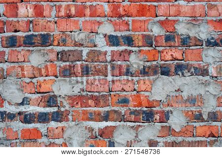 Red Old Worn Brick Wall With Concrete Texture Background