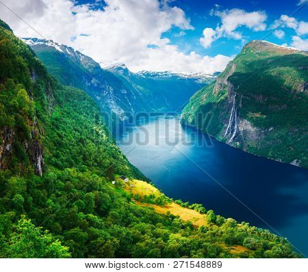 Breathtaking view of Sunnylvsfjorden fjord and famous Seven Sisters waterfalls, near Geiranger village in western Norway.