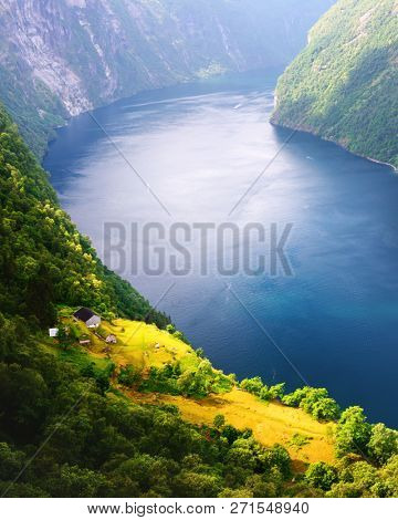 Breathtaking view of Sunnylvsfjorden fjord and famous Seven Sisters waterfalls, near Geiranger village in western Norway.