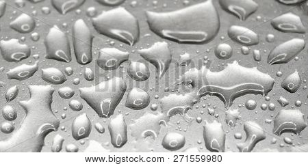 Mercury on textural metal surface close up