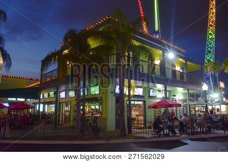 Orlando, Florida.  November, 2018 Green Vintage Sport Bar And Colorful Attractions Park At Old Town 