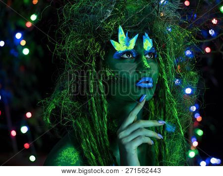 Mystic Green Dryad In Uv Fluor Black Light With Glowing Trees On Background