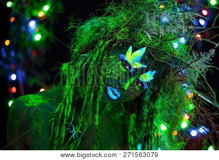 Mystic Green Dryad In Uv Fluor Black Light With Glowing Trees On Background