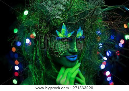 Mystic Green Dryad In Uv Fluor Black Light With Glowing Trees On Background