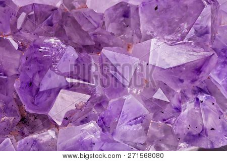 Detail of the translucent crystals of an Amethyst stone.