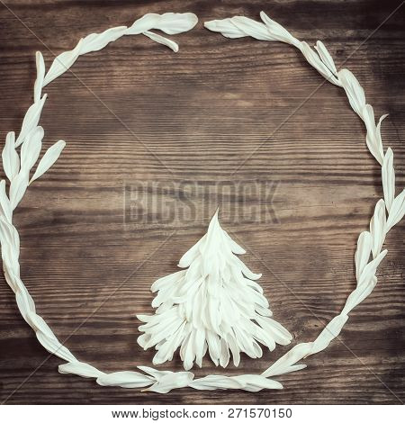 Christmas Background With Christmas Tree Of White Petal On Rusti