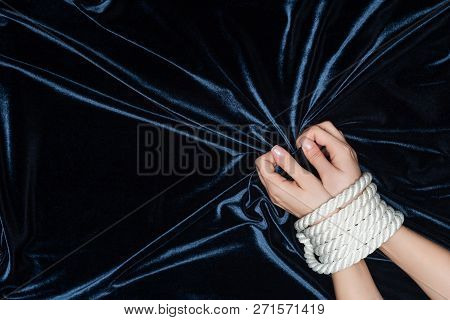 Close Up Of Female Hands Tightly Bounded With Rope