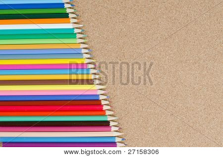 The colour pencils on Ã?Ã?Ã?ÃÂorkboard. School concept