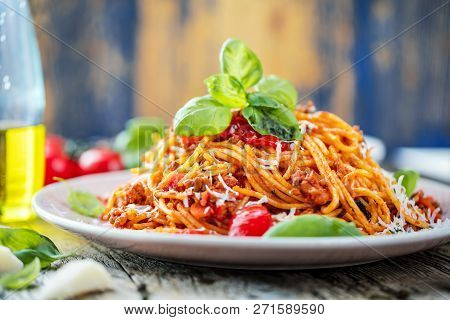 Fresh And Delicious Spagetti Bolognese On Wooden Table.