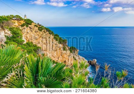 Lighthouse At The Cape Cliffs In Cala Ratjada On Majorca Island, Spain Mediterranean Sea