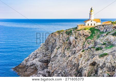 Beautiful View Of The Lighthouse At Cliffs On The Coast Of Majorca Island, Spain Mediterranean Sea