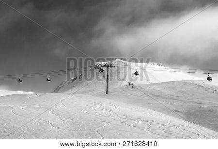 Black And White View On Gondola Lift And Off-piste Ski Slope In Fog At Nice Sunny Evening. Caucasus 