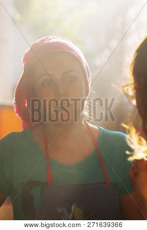 Portrait Of A Turkish Young Woman That Is Preparing And Selling Food At Bazaar: In Front Of The Woma