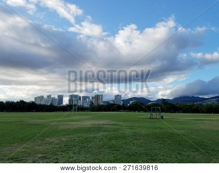 Kapiolani Park And Buildings Of Honolulu With Clouds In The Air On Oahu, Hawaii.