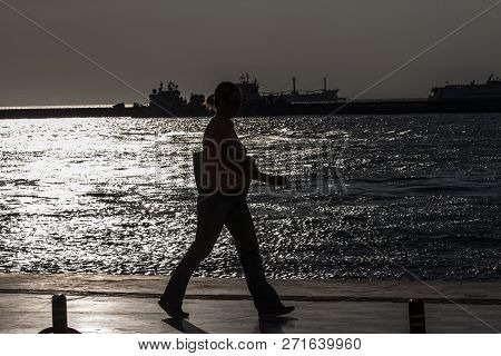 Back Lit Woman Walking At Seaside In Kordon - Alsancak - Izmir (turkey)
