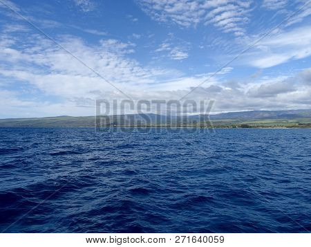 Beautiful Pakala Village Coast With Clouds Covering The Tops Of Mountains As Seen From Boat Off Shor