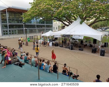 Honolulu - April 19, 2017:  People Dance As Musician Taimane Jams At Earth Day Concert Festival On T