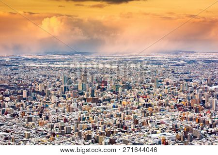 Sapporo, Japan winter skyline view from the mountains at dusk.
