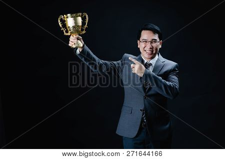 Asian Man In Formal Suit Holding And Rise Golden Trophy Cup, Reward Of Target Achievement Winner , P