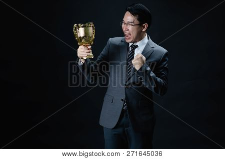 Asian Man In Formal Suit Holding And Rise Golden Trophy Cup, Reward Of Target Achievement Winner, Pr