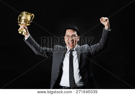 Asian Man In Formal Suit Holding And Rise Golden Trophy Cup, Reward Of Target Achievement Winner, Pr