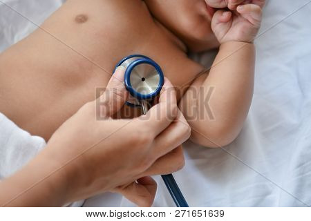 Baby Sick Concept. The Doctor Is Examining The Baby's Illness. Babies Are Not Comfortable In The Hos